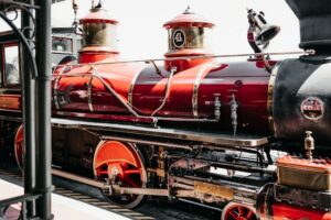 picture of a black and red train locomotive sitting on tracks